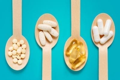 10 Easy Hacks to Boost Your Metabolism Naturally | metabolism shutterstock 1017755419 healthy supplements in spoons to boost metabolism