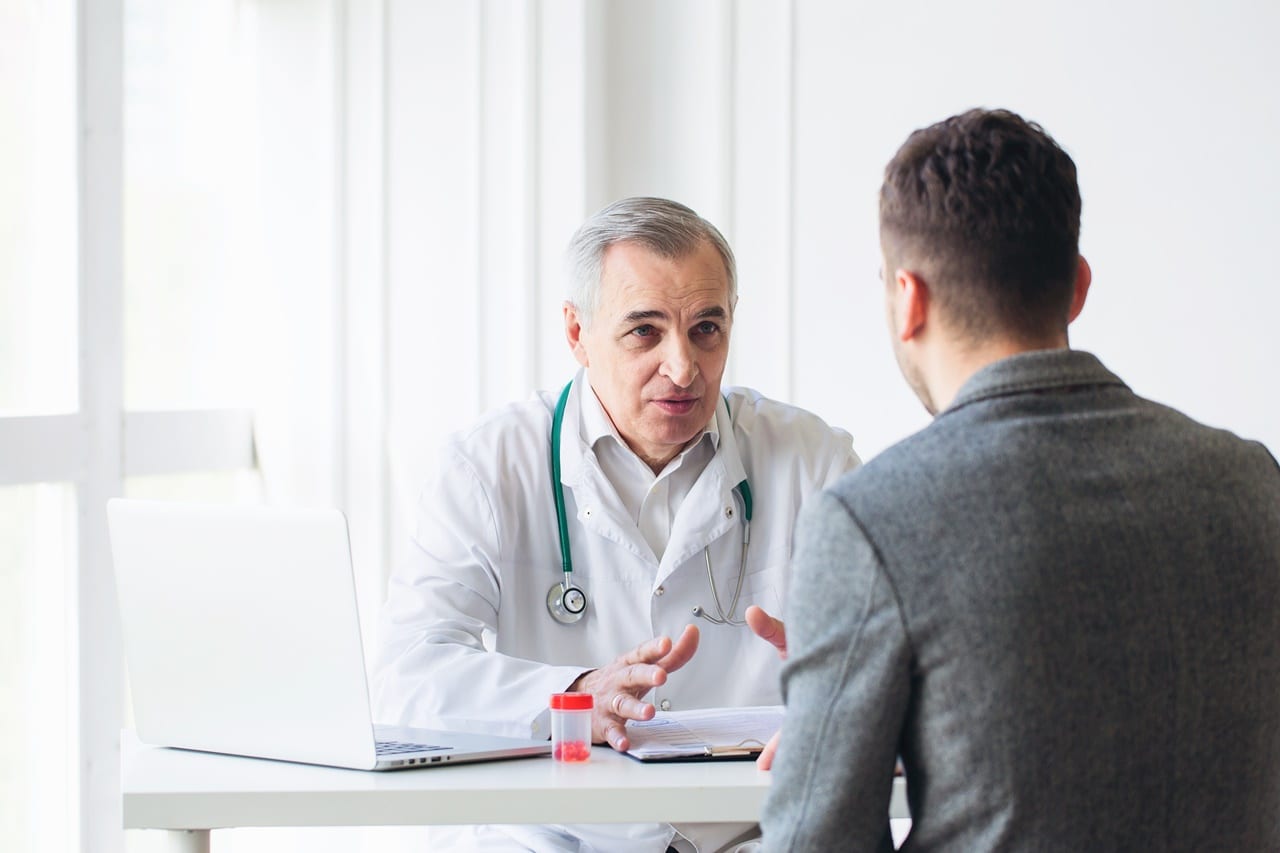 How to Test for Mold in Your Body | mold shutterstock 430385620 2 young patient talking to his doctor about mold testing