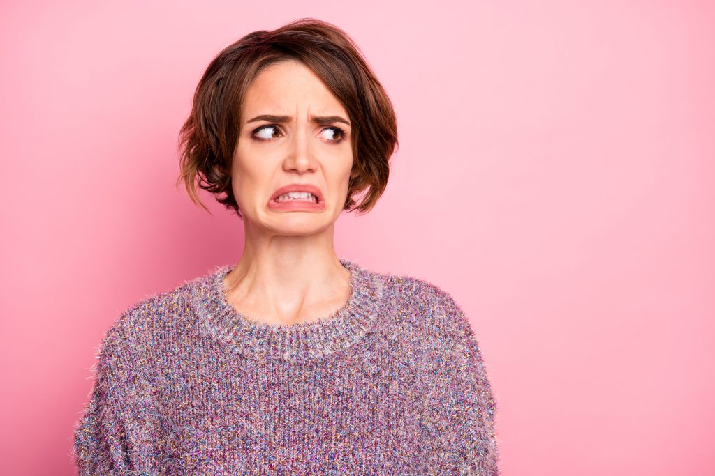 Herx Reactions - Woman With Unpleasant Look Reaction Grimacing