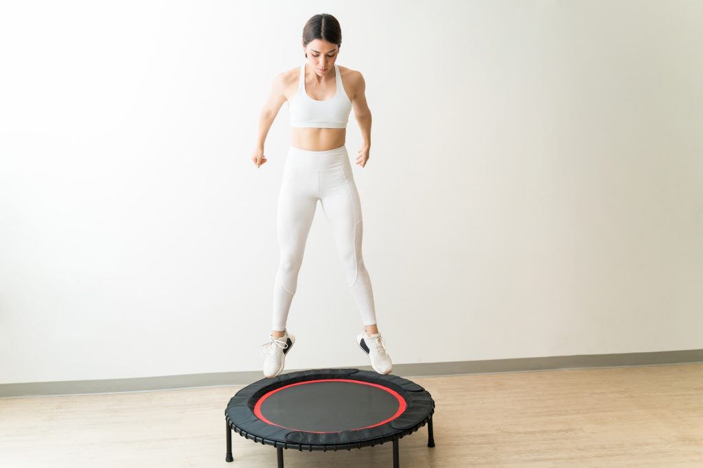 Cycle Mapping: The Best Foods, Workouts And Supplements for Your Cycle | Cycle Mapping female rebounding against wall during interval training at fitness studio Cycle Mapping - female rebounding against wall during interval training at fitness studio