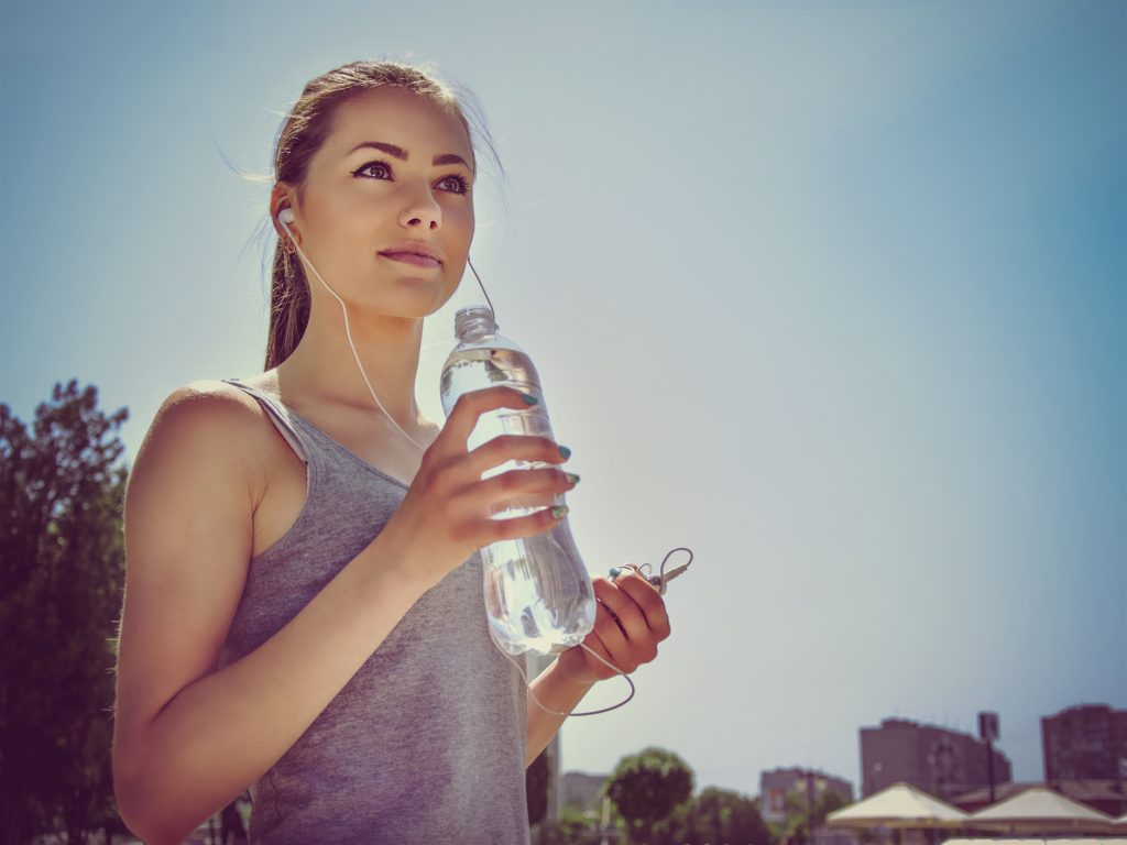 How to Get a Flat Stomach & Toned Muscles Without Starving or Over Exercising | How to Get a Flat Stomach And Toned Muscles Girl is engaged in sports while listening to music resting and drinking water How to Get a Flat Stomach And Toned Muscles - Girl is engaged in sports while listening to music, resting and drinking water.