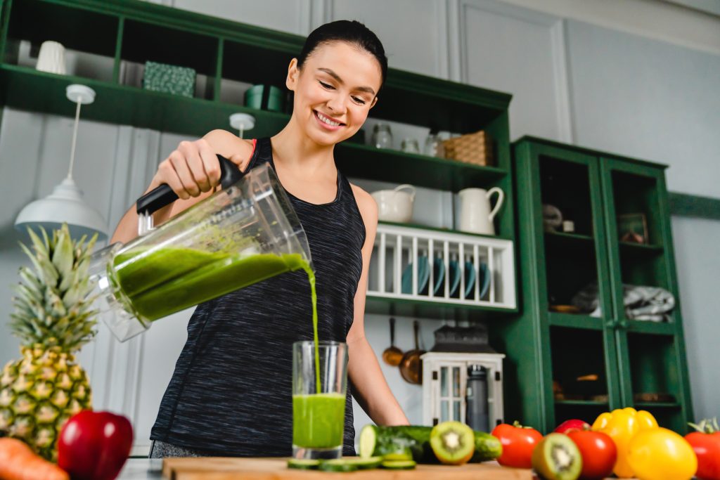 How to Get a Flat Stomach & Toned Muscles Without Starving or Over Exercising | How to get a flat stomach young slim girl making fresh organic smoothie How to get a flat stomach - young slim girl making fresh organic smoothie