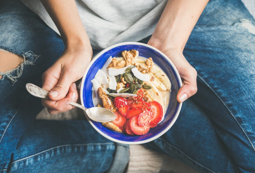 5 Best Natural Tips to Get Your Period Back | get your period back Eating healthy breakfast bowl. Yogurt granola seeds fresh and dry fruits and honey in blue ceramic get your period back - Eating healthy breakfast bowl. Yogurt, granola, seeds, fresh and dry fruits and honey in blue ceramic