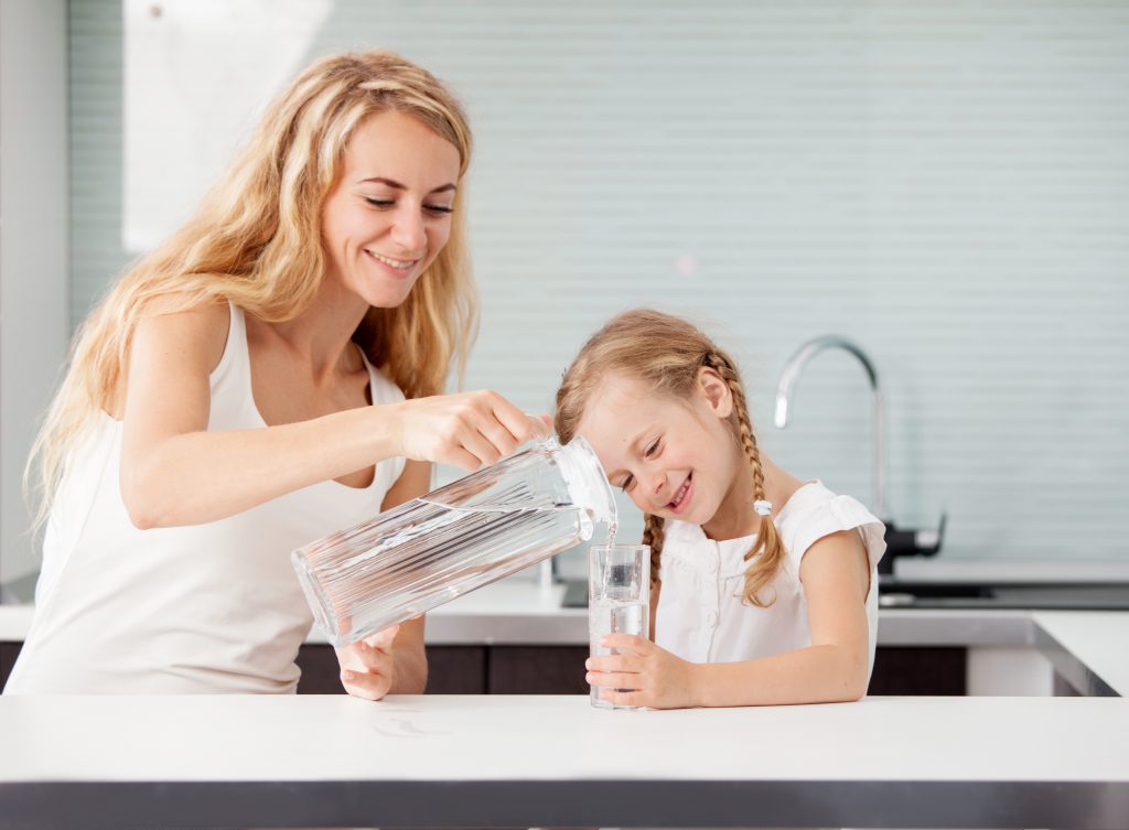 Understanding Liver Detoxification: Phases 1, 2, and 3 | liver detoxification Child with mother drinking water from glass liver detoxification - Child with mother drinking water from glass