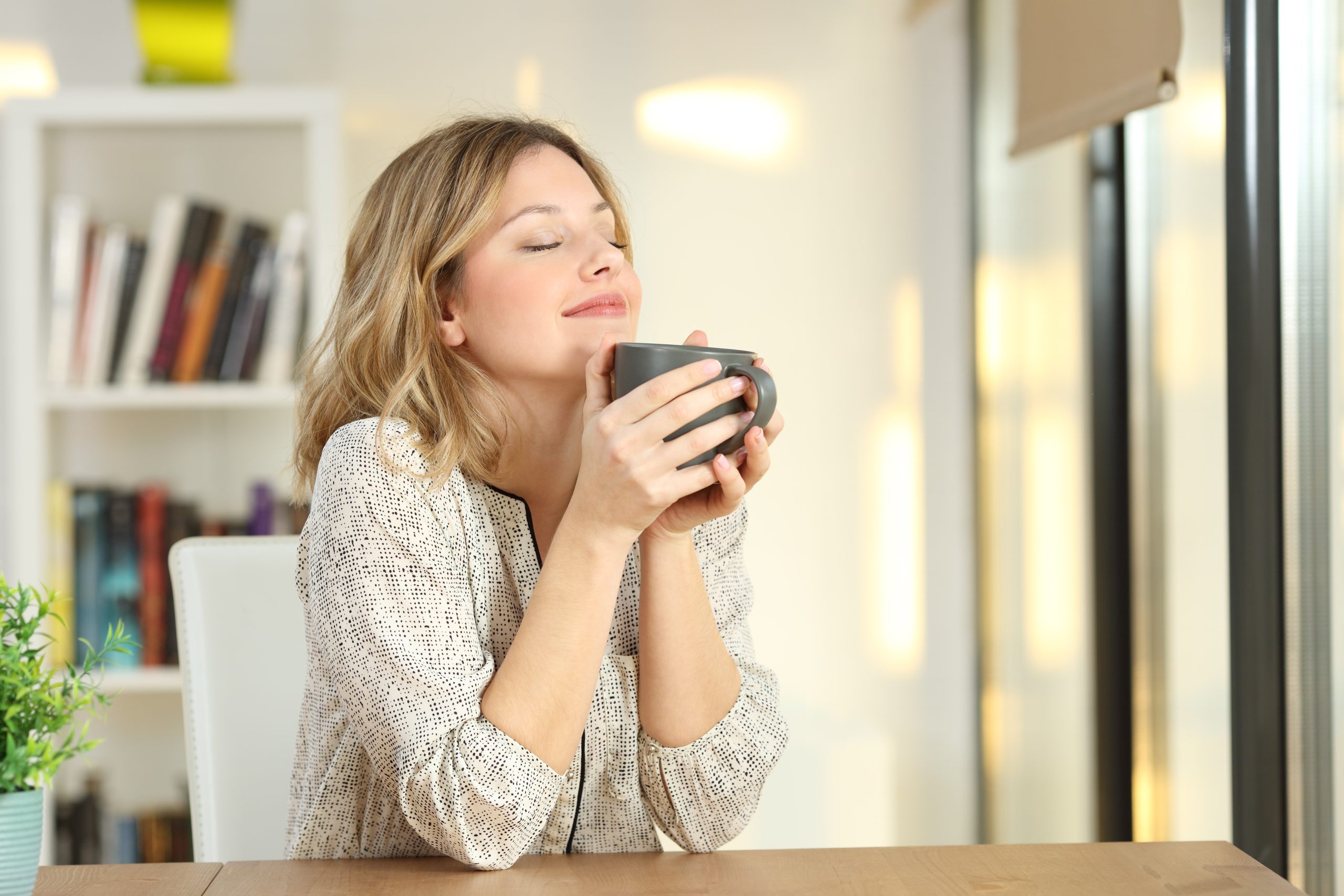 The Best Coffee Alternatives for a Healthy Gut, Balanced Hormones & More Energy (My Top “Gut Luv Coffee” Picks!) | best coffee alternatives woman breathing and holding a coffee mug at home scaled best coffee alternatives - woman breathing and holding a coffee mug at home