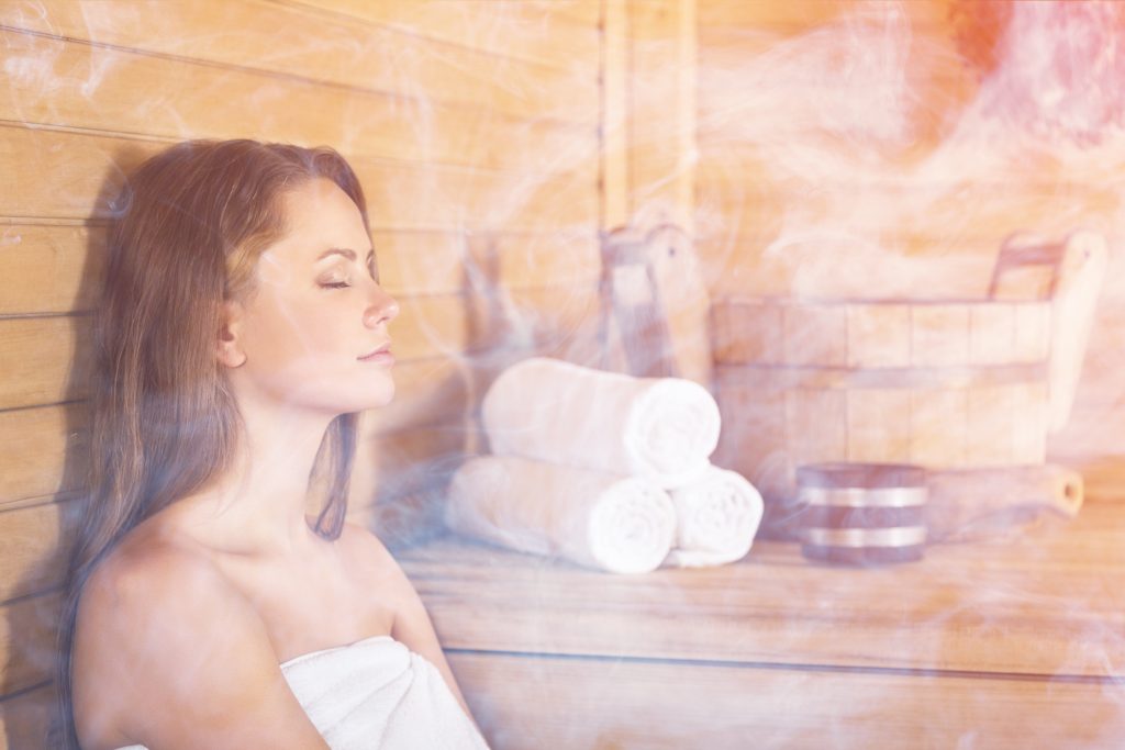 5 Best Holistic Cancer Recovery Strategies: A Functional Medicine Approach | holistic cancer recovery strategies a woman having daily sauna session holistic cancer recovery strategies - a woman having daily sauna session