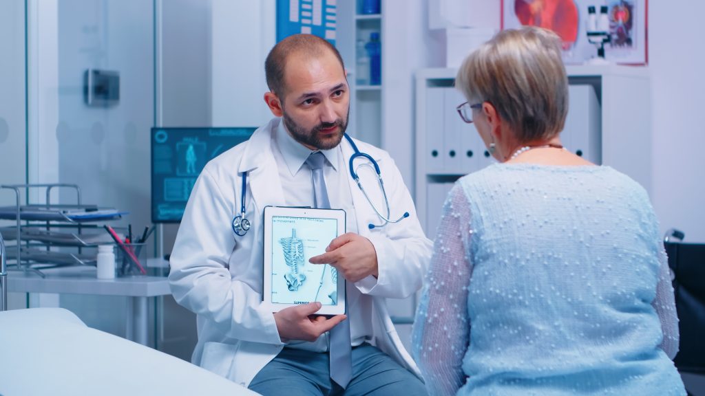 5 Best Holistic Cancer Recovery Strategies: A Functional Medicine Approach | holistic cancer recovery strategies a woman patient talking to her doctor about healthcare treatment holistic cancer recovery strategies - a woman patient talking to her doctor about healthcare treatment