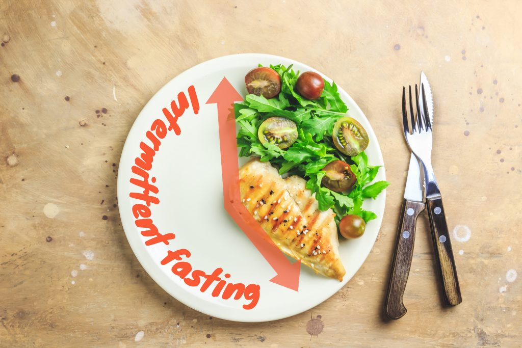 Eat for Your Gut Type: 8 Strategies to Boost Digestion | gut type Intermittent fastin concept. One third plate with healthy food and two third plate is empty gut type - Intermittent fasting concept. One-third plate with healthy food and two-third plate is empty