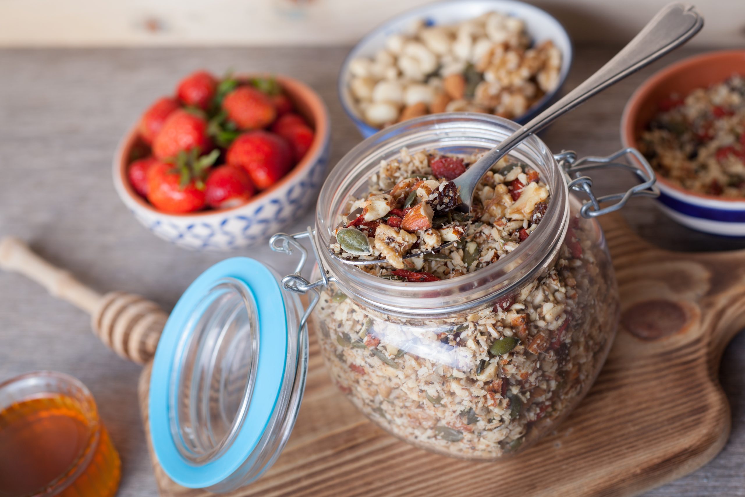 Have You Accidentally Eaten Foods That Cross-React with Gluten? Avoid These Top 10 Triggers | foods that cross react with gluten raw paleo style muesli mixed nuts seeds goji berries chia honey and strawberries scaled foods that cross-react with gluten - raw paleo style muesli, mixed nuts, seeds, goji berries, chia, honey and strawberries