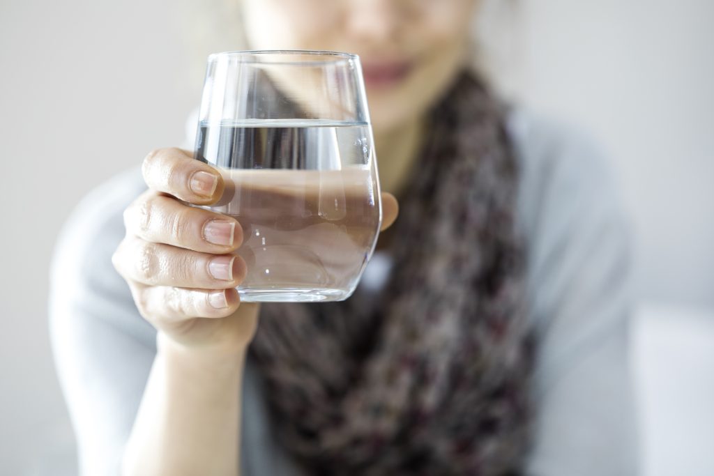 Alternative Treatments for Cancer: 6 Strategies to Heal Cancer Naturally with Functional Medicine | Alternative Treatments for Cancer Young woman drinking water Alternative Treatments for Cancer - Young woman drinking water