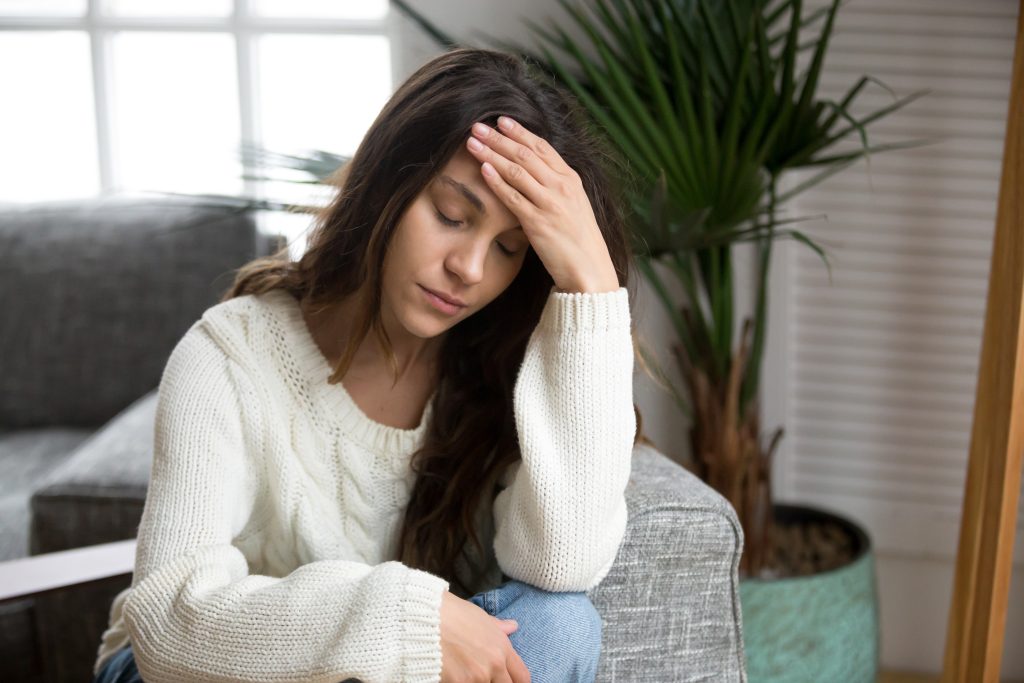 Holistic Colonoscopy Prep Diet & Supplements: Prep for a Colonoscopy Naturally | colonoscopy prep diet tired young woman feeling strong headache touching forehead depressed colonoscopy prep diet - tired young woman feeling strong headache touching forehead, depressed