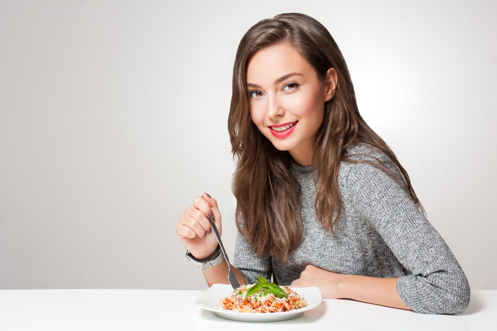 The Ultimate Guide to Gut Health + 3 Essentials to Heal Your Gut | gut health woman eating Italian pasta gut health - woman eating Italian pasta