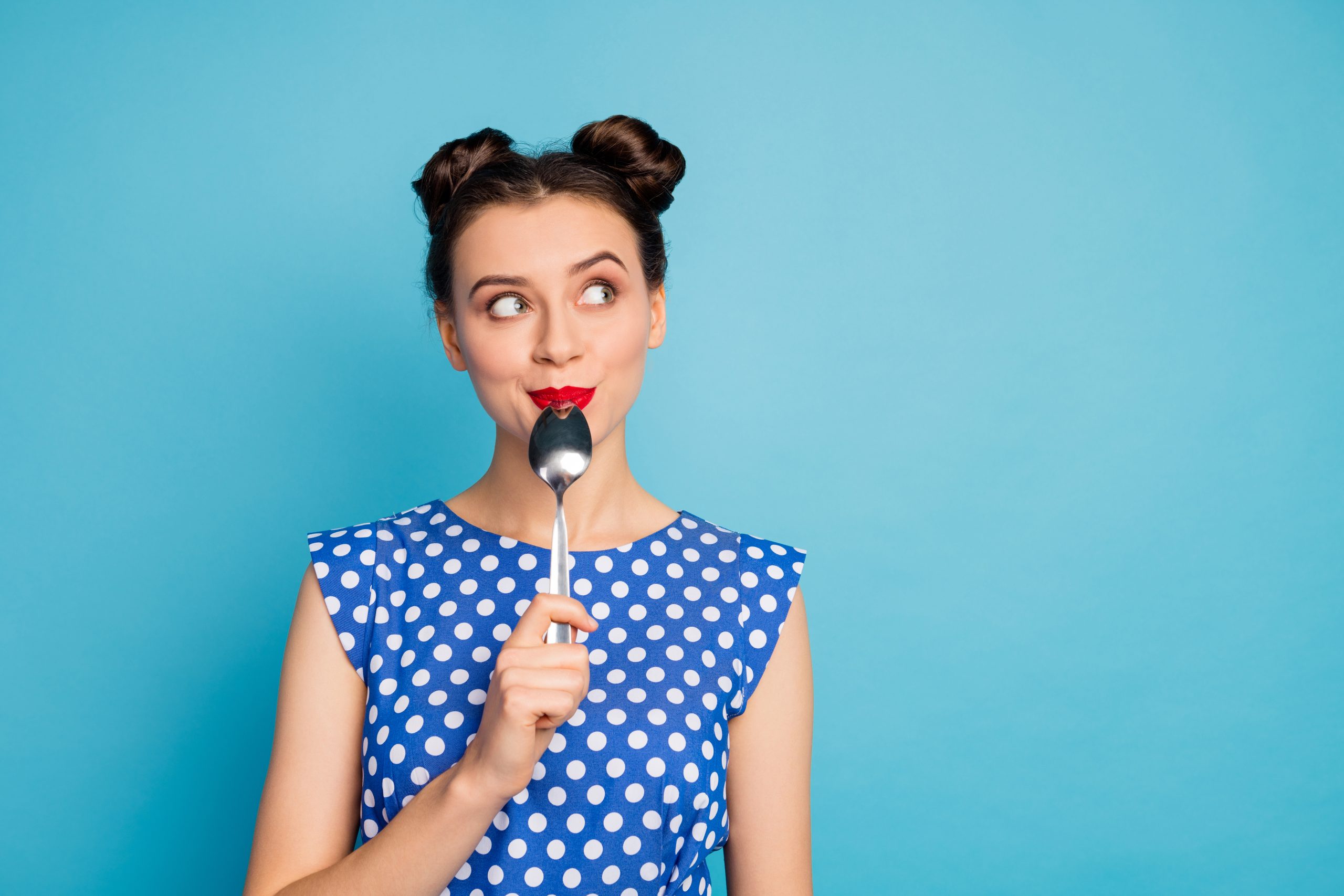 The 7 Gut Types: Which One Are You? | gut types lady holding metal spoon in mouth look up empty space dreaming about tasty food scaled gut types - lady holding metal spoon in mouth look up empty space dreaming about tasty food