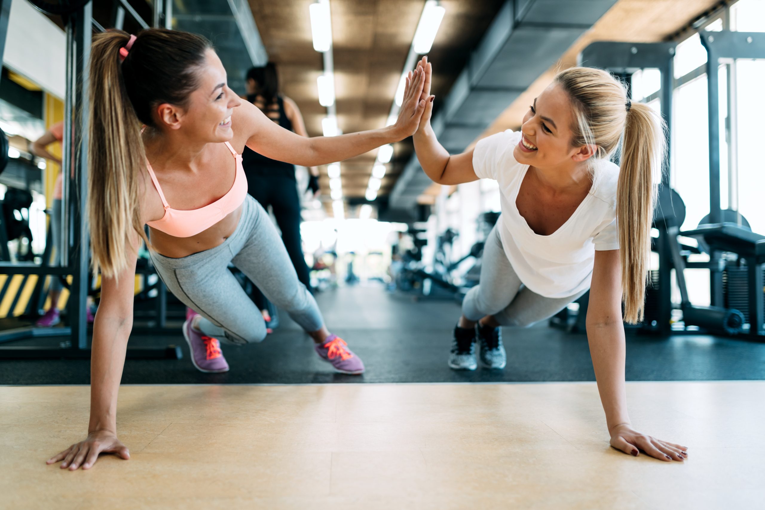 How to Lose Weight And 10x Your Health With Spark Joy | spark joy Two attractive fitness girls doing push ups scaled spark joy - Two attractive fitness girls doing push ups