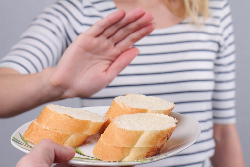 The Best Gluten-Free Bread Recipe: 4 Easiest Ways | gluten free bread recipe Gluten intolerance and diet concept. Woman refuses to eat white bread gluten-free bread recipe - Gluten intolerance and diet concept. Woman refuses to eat white bread
