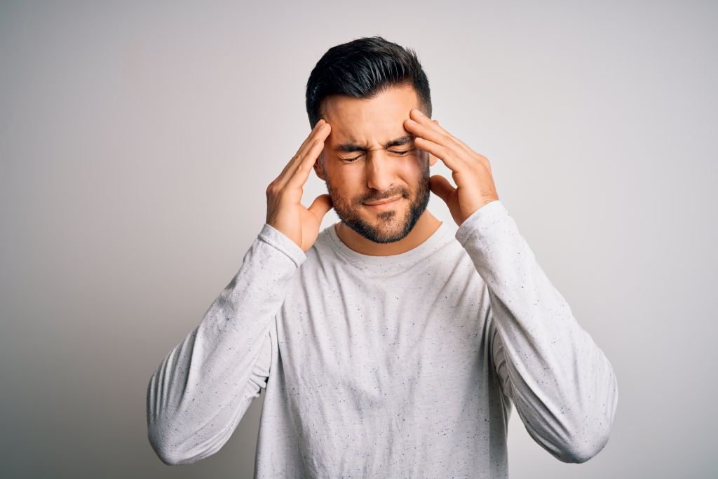 How To Detoxify From Mold Exposure - Man Touching His Head Feeling Sick