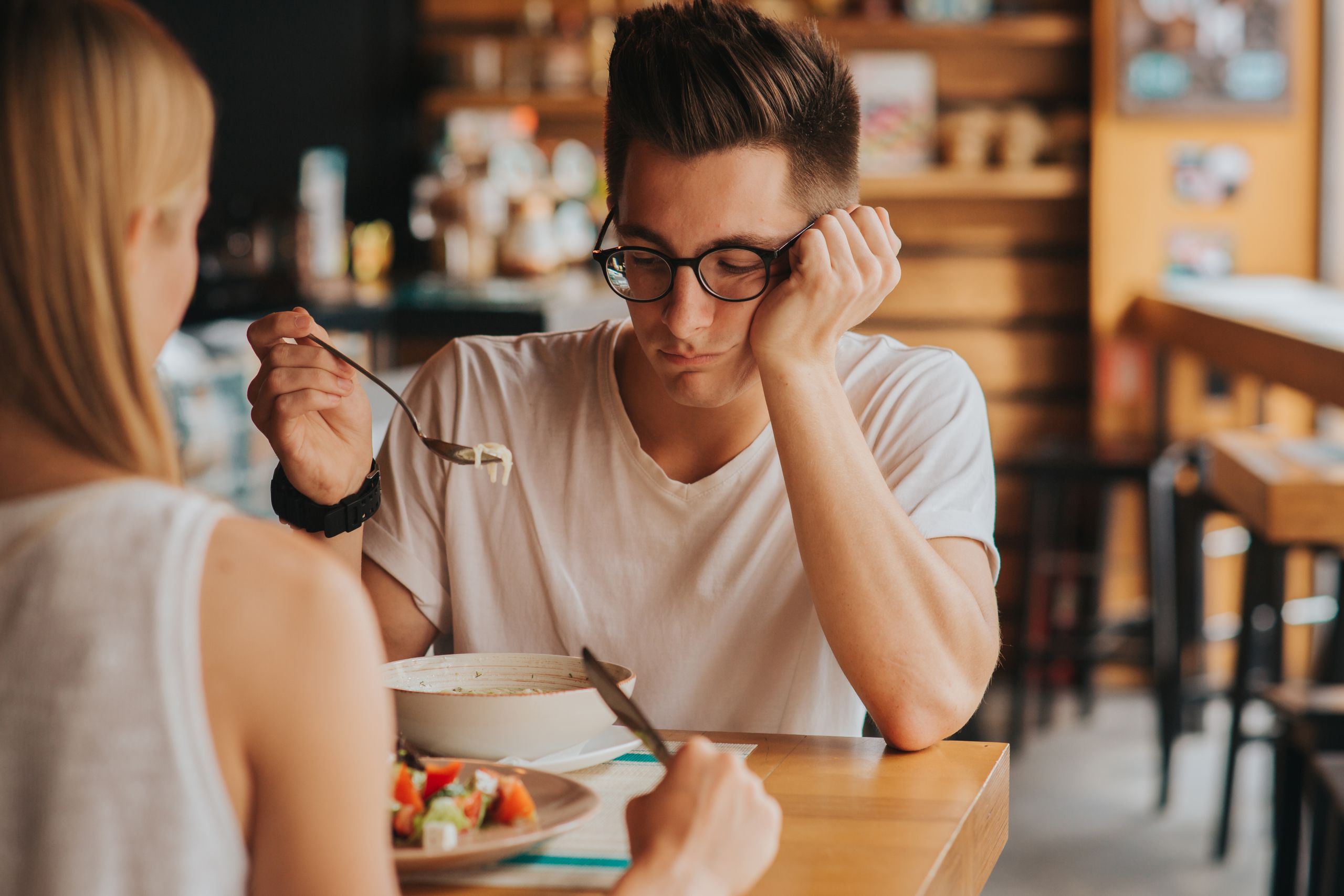 Eating Disorders And Gut-Brain Connection: 8 Research-Backed Links | eating disorder nd gut connection young man looking at food scaled eating disorders and gut connection, young man looking at food