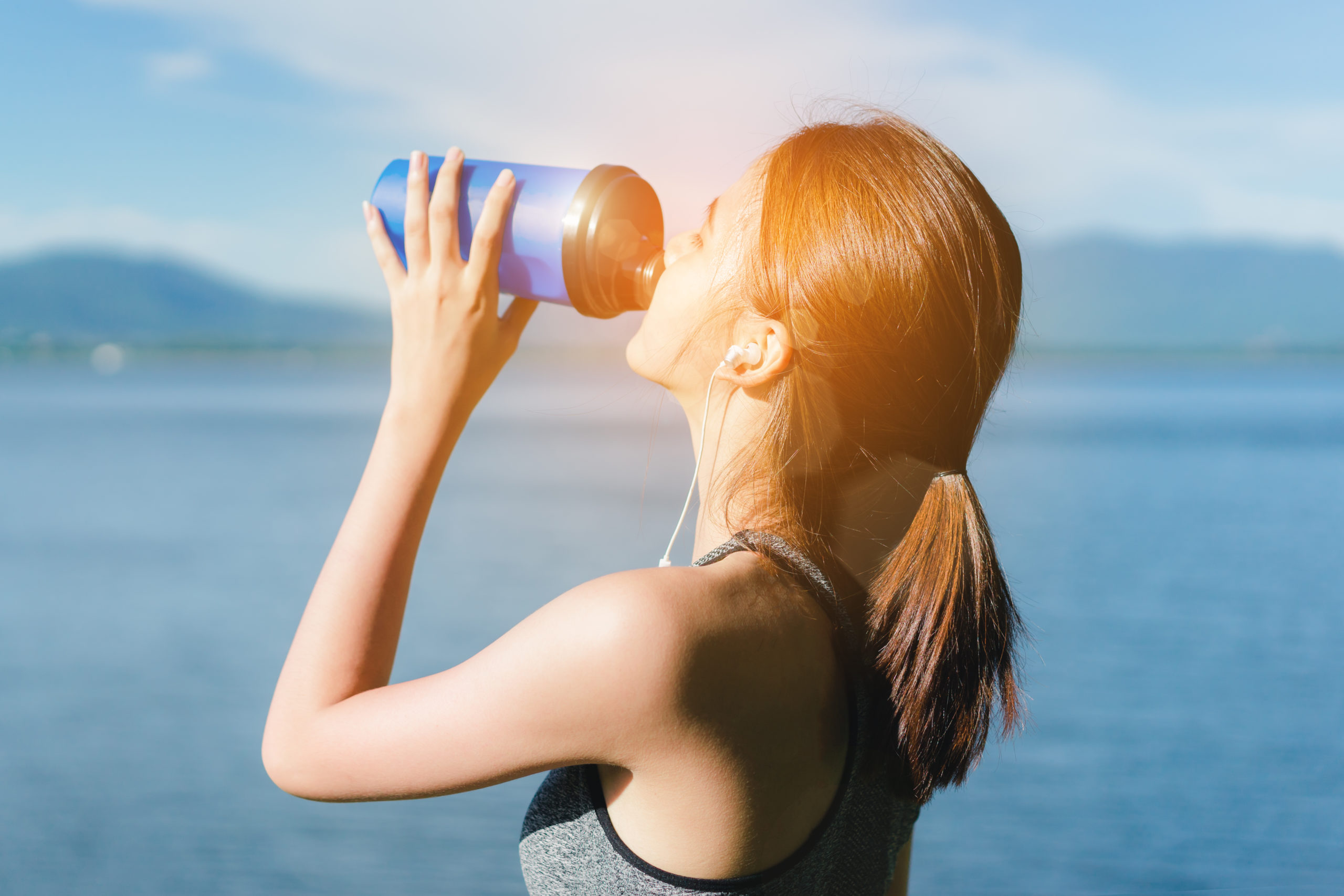 Electrolytes Do the Body Good | electrolytes shutterstock 655736203 scaled a lady taking a break to drink natural electrolytes