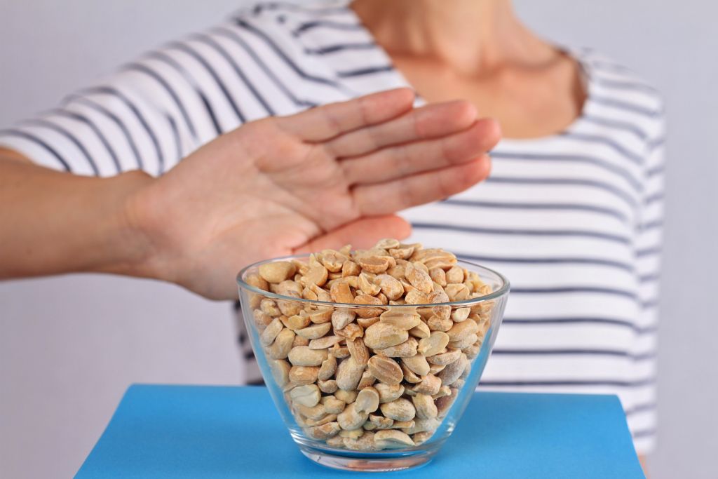 3 Gut Tests You Can Do at Home | gut tests woman refusing to eat peanuts due to food allergy gut tests - woman refusing to eat peanuts due to food allergy